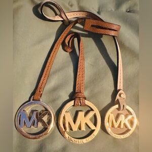 Michael Kors Gold Tone and Brown MK Logo Pendant Hang tags